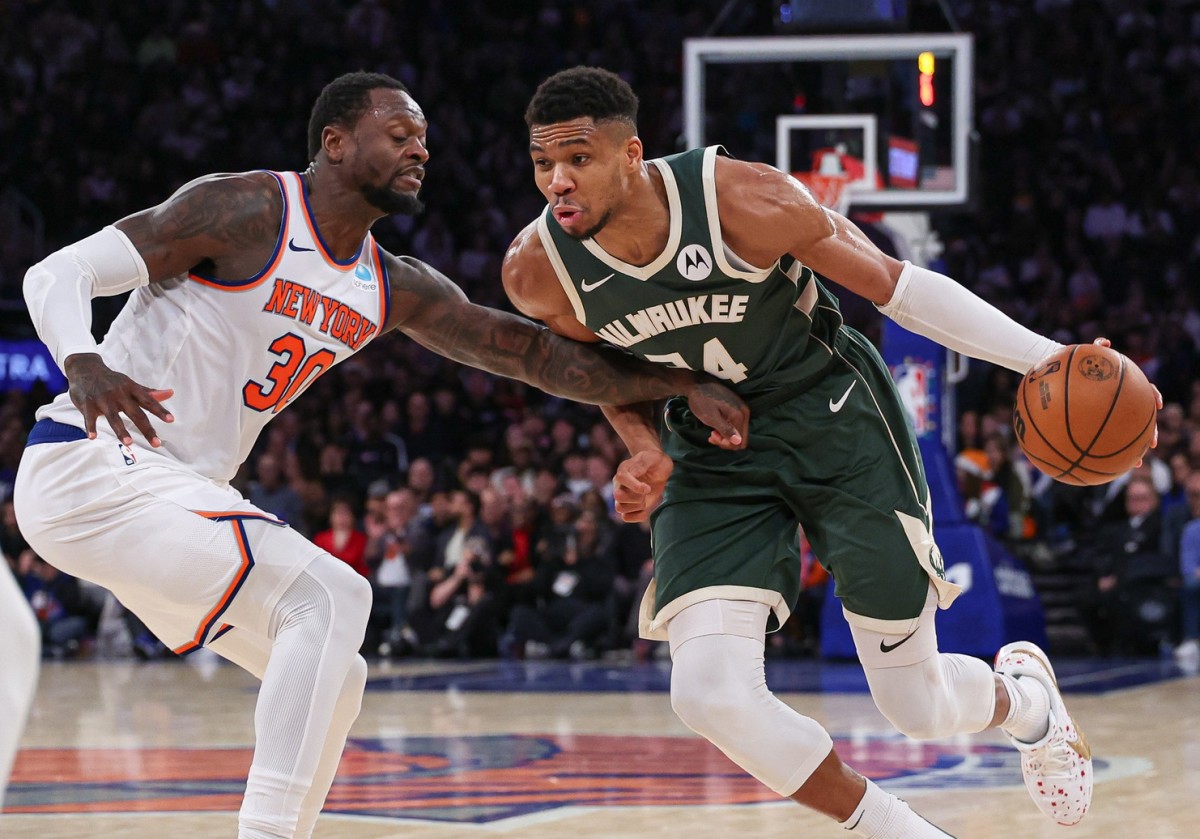 Milwaukee Bucks forward Giannis Antetokounmpo (34) dribbles against New York Knicks forward Julius Randle (30)